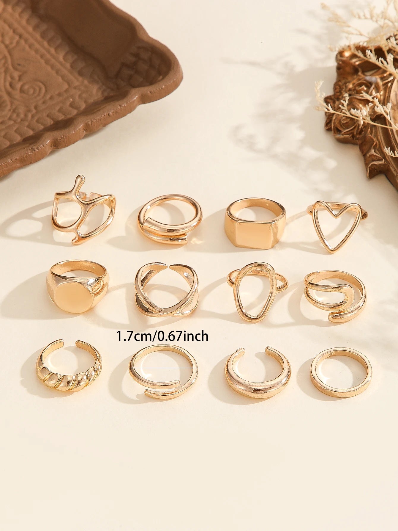 The 12-piece set of metallic-looking smooth rings is perfect for women to wear at daily parties.