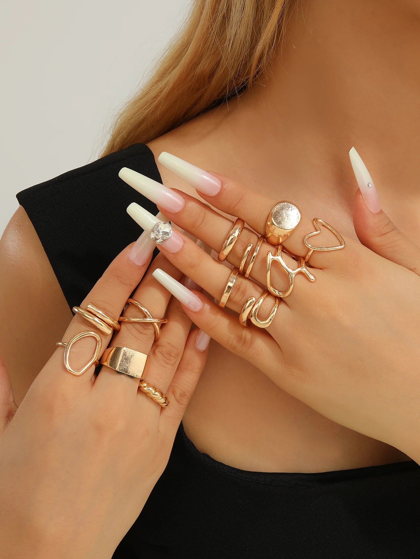The 12-piece set of metallic-looking smooth rings is perfect for women to wear at daily parties.